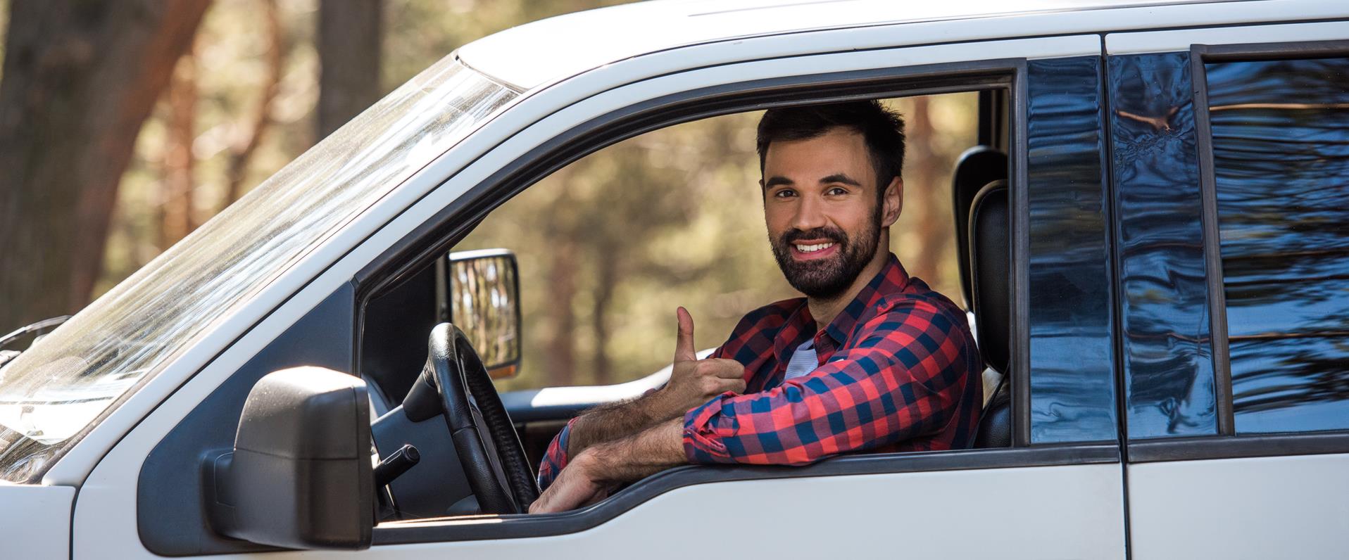 Buyer and seller shaking hands after a successful used car negotiation