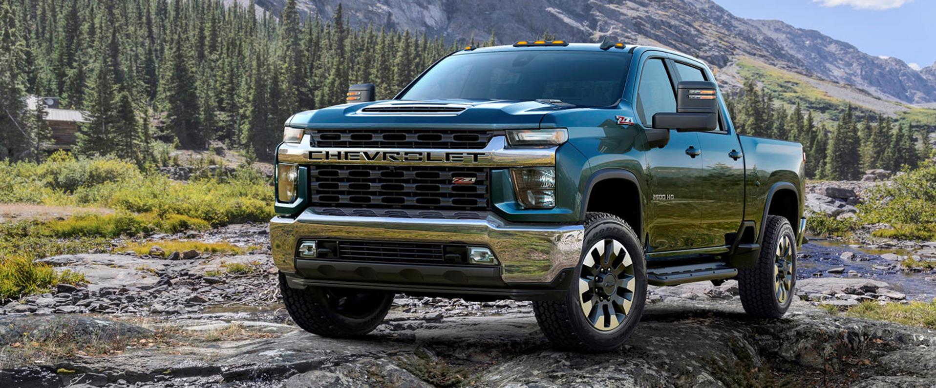 Rugged pickup truck on a Michigan forest trail during autumn