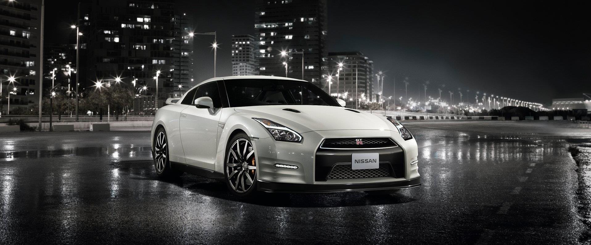 Spring vehicle inspection after Michigan winter — checking suspension, tires, and paint for damage